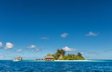 small tropical island with Beach Villas