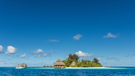 small tropical island with Beach Villas